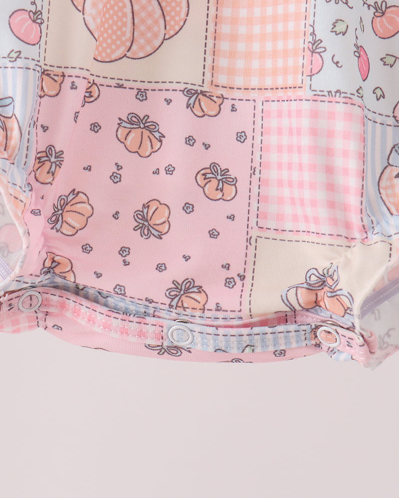 Patchwork romper bottom hem with ruffle trim and pink pumpkin print