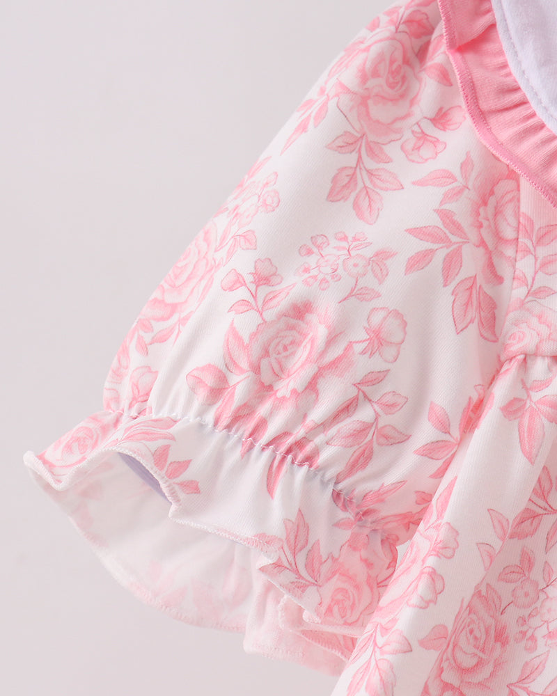 Pink floral dress with layered ruffle hem and gathered sleeve puff