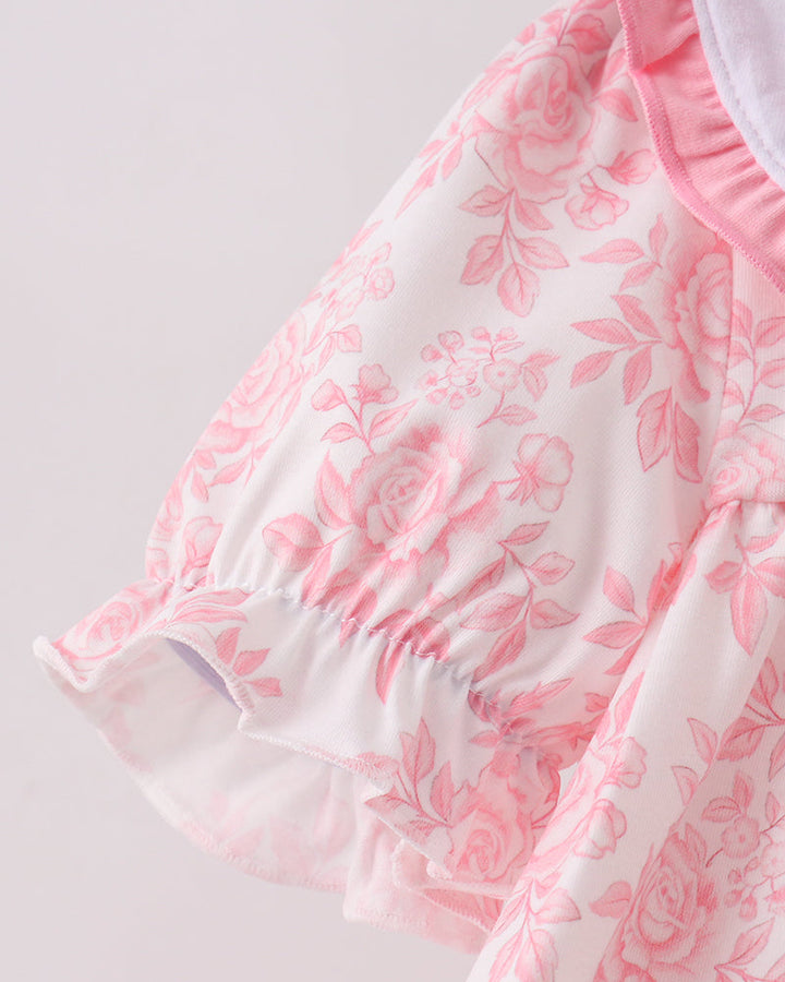 Pink floral dress with layered ruffle hem and gathered sleeve puff