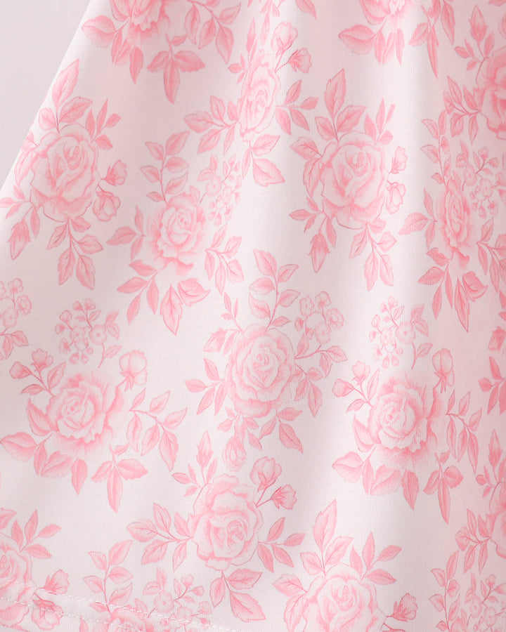 Pink floral ruffle dress with all-over rose pattern and gathered skirt