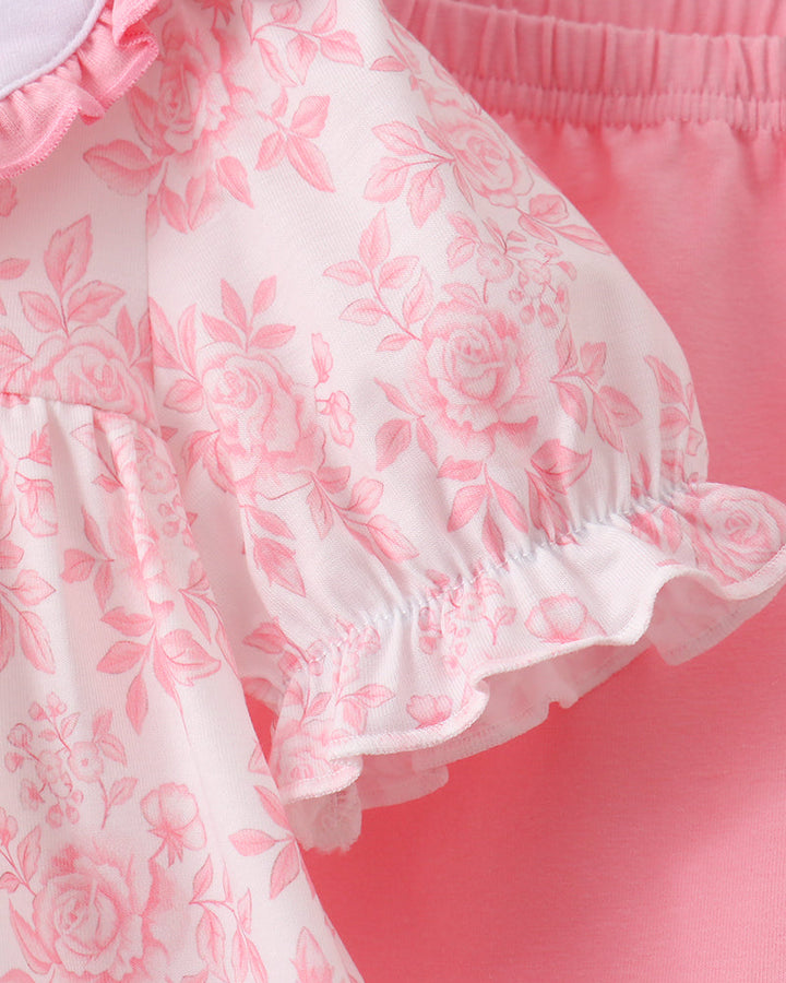 Pink floral dress bodice with gathered sleeves and ruffle cuff trim