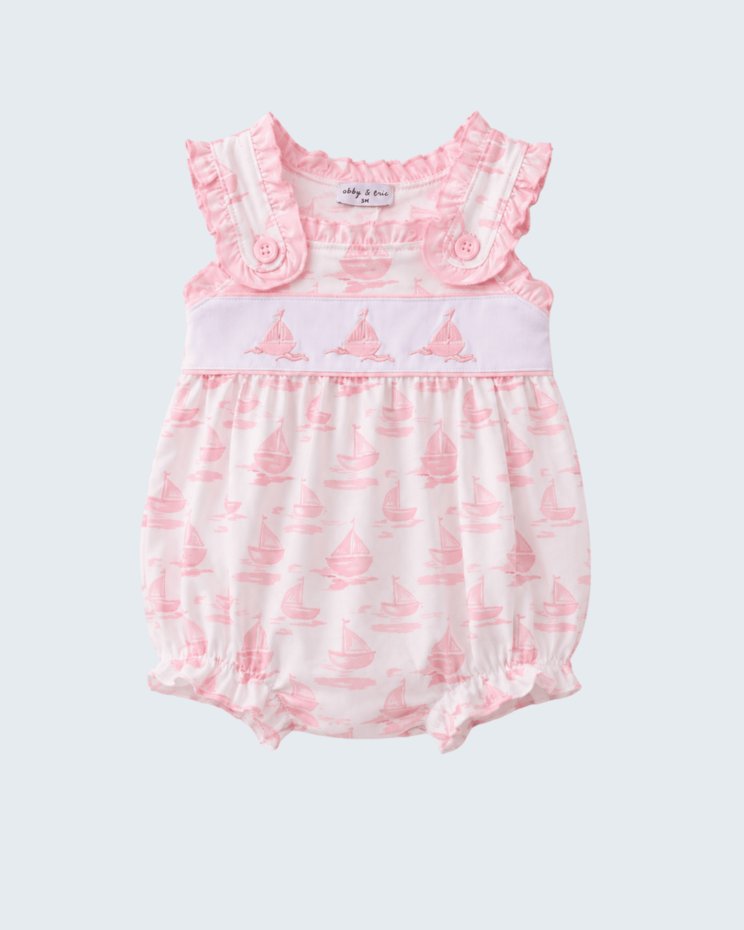 Baby romper with pink floral design on a white background