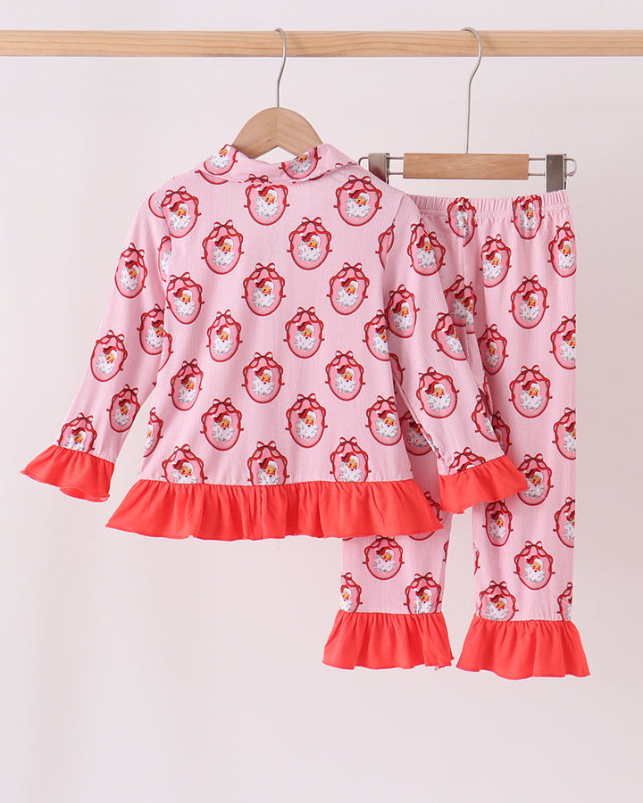 Pink pajama set with Santa face print, ruffle top, and matching flared pants