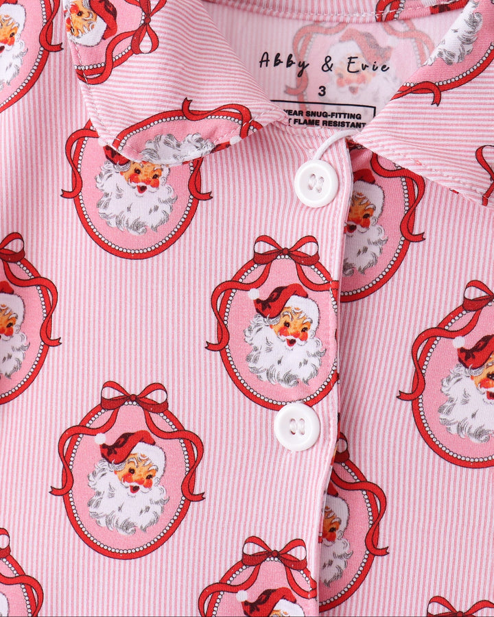 Pink pajama top front with button placket and Santa face print