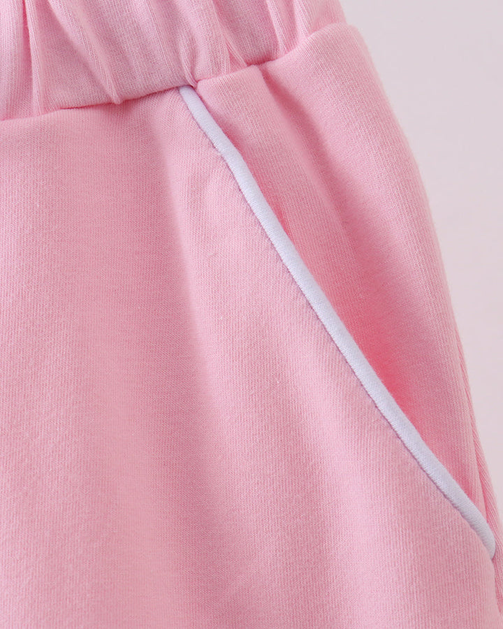 Pink skort with side seam detail and contrast-edged trim