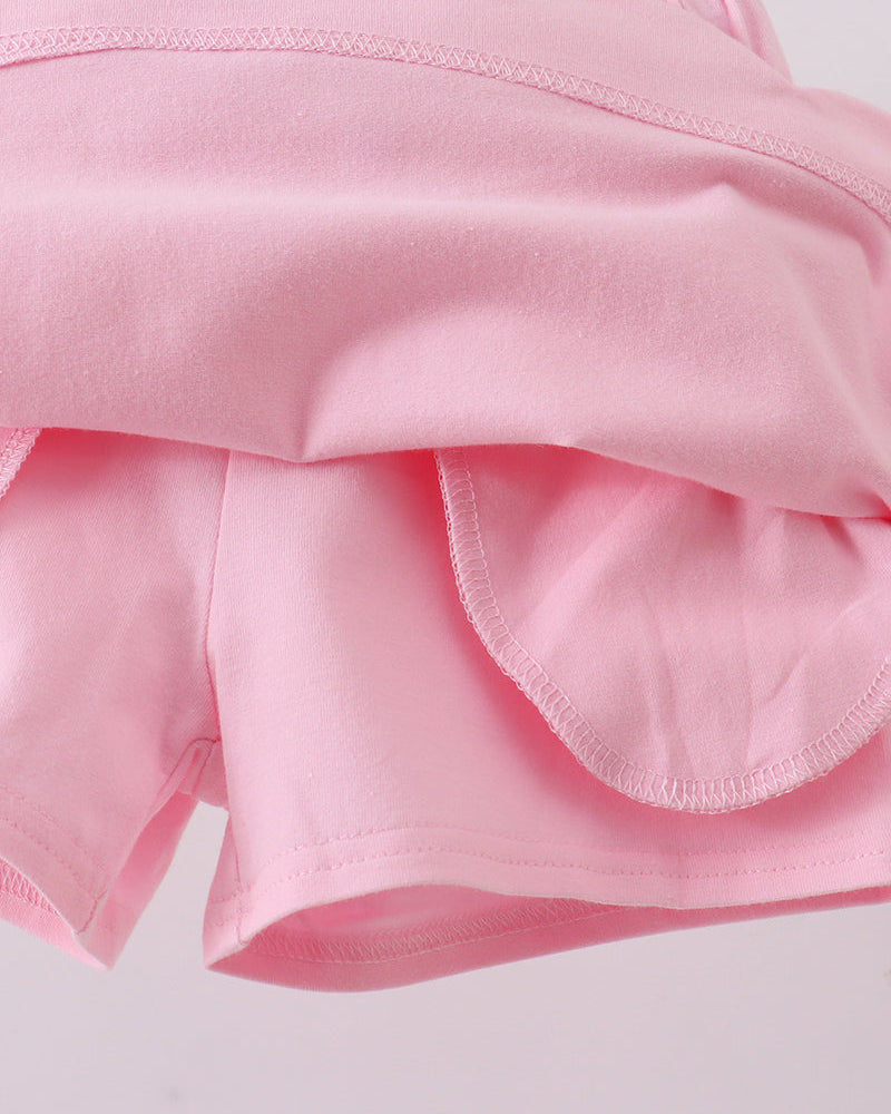 Pink skort showing layered ruffle at the back hemline