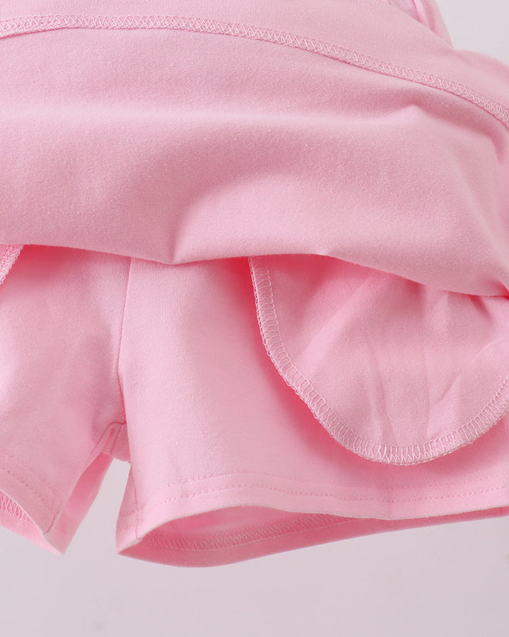 Pink skort showing layered ruffle at the back hemline