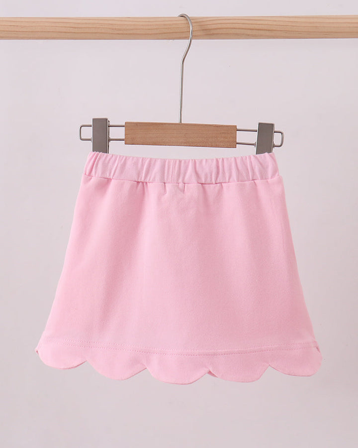 Pink skort with elastic waistband and scalloped skirt hem