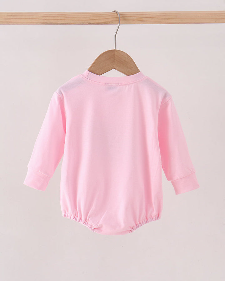 Pink long-sleeve bubble romper back view with gathered waist