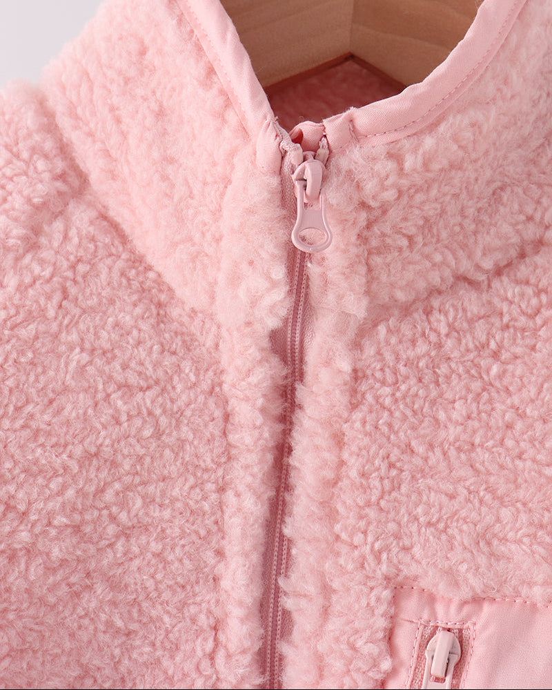 Pink fleece jacket with stand collar and front zipper, close-up