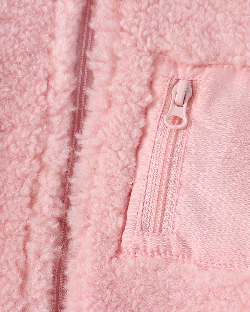 Pink fleece jacket front zipper detail with stitched pocket panel