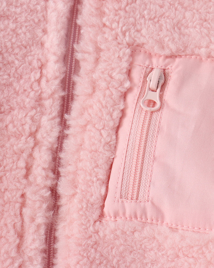 Pink fleece jacket front zipper detail with stitched pocket panel