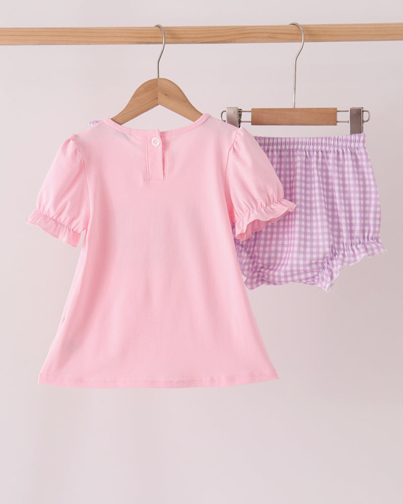 Pink toddler bloomer set with plain pink shirt and purple gingham ruffle shorts