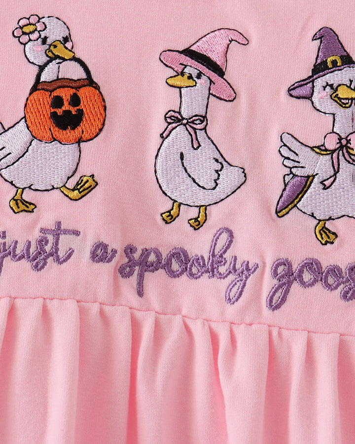 Pink dress with stitched cartoon geese, pumpkin, and “spooky” embroidery