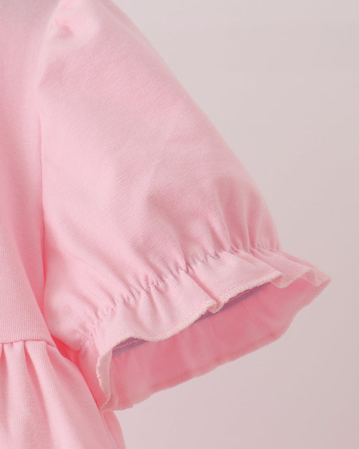 Pink short-sleeve ruffle dress with gathered cuff