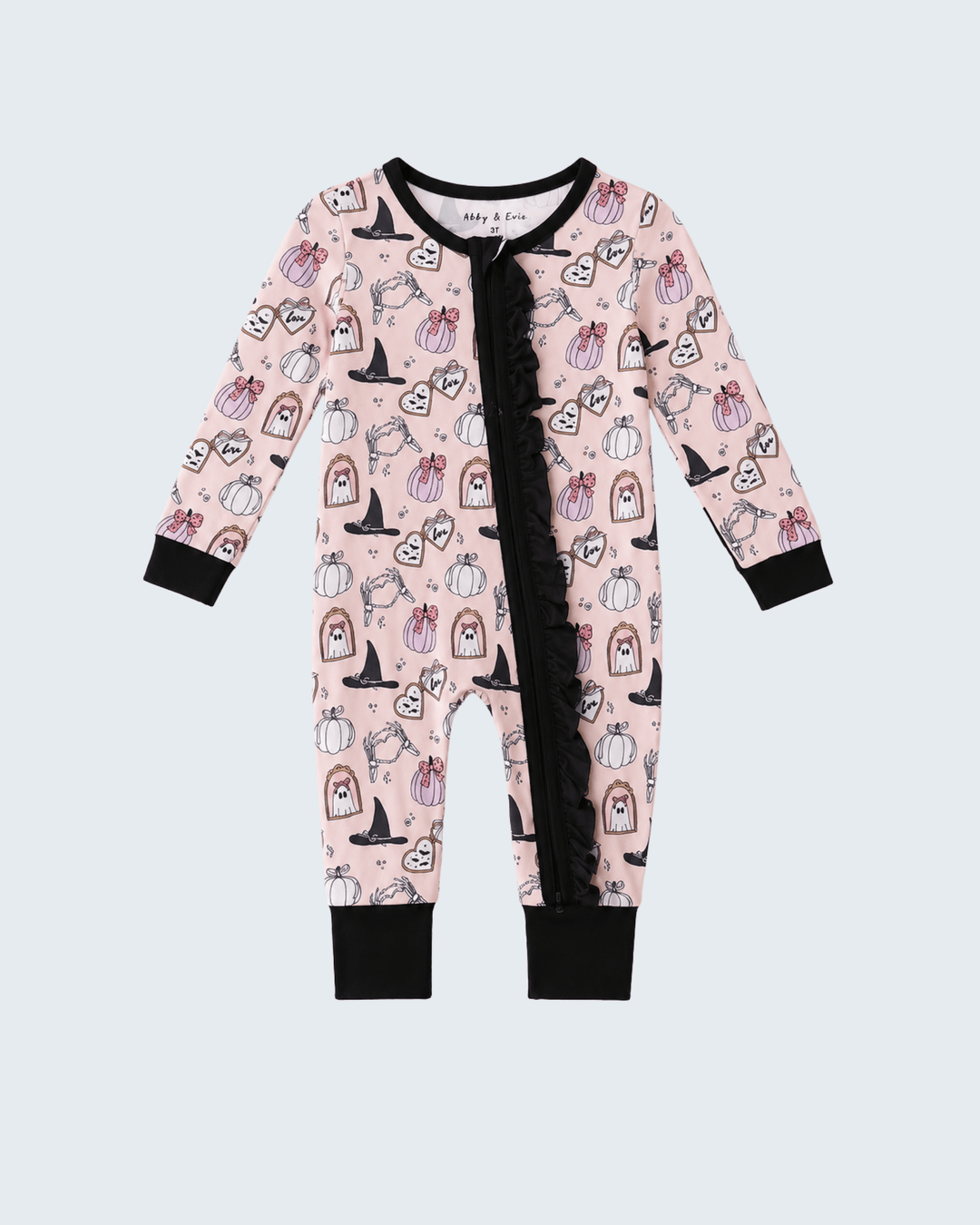 A baby long-sleeve footless romper in light pink with a black ruffle down the front and an all-over Halloween print of pumpkins, ghosts, and witches, shown on a light gray background.