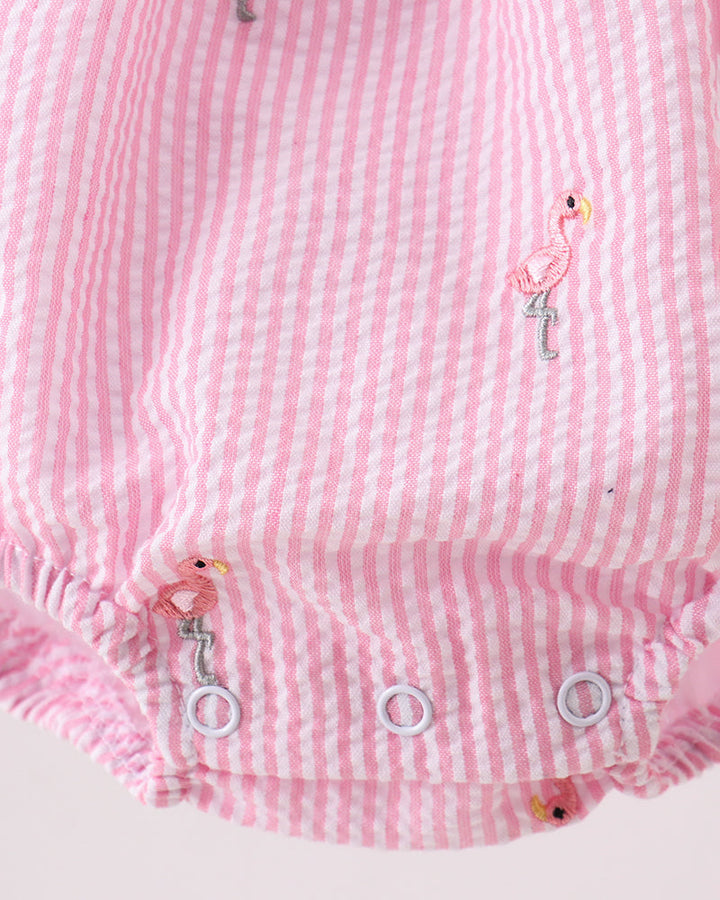 Pink and white striped baby romper with embroidered flamingo design on a light pink background