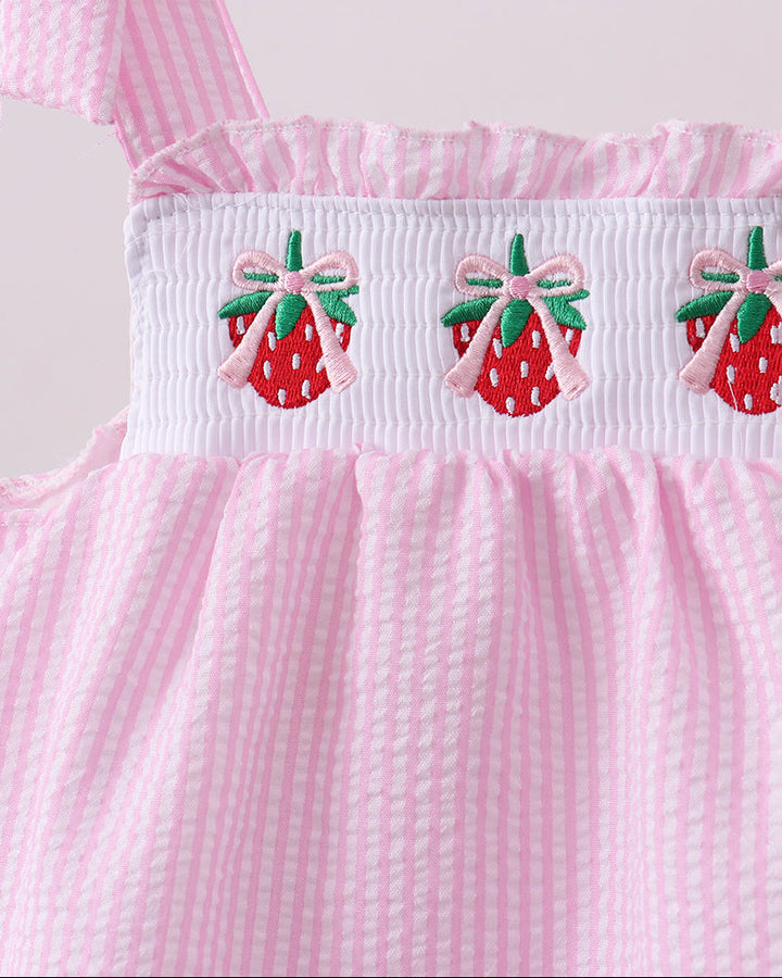 Pink fabric with strawberries