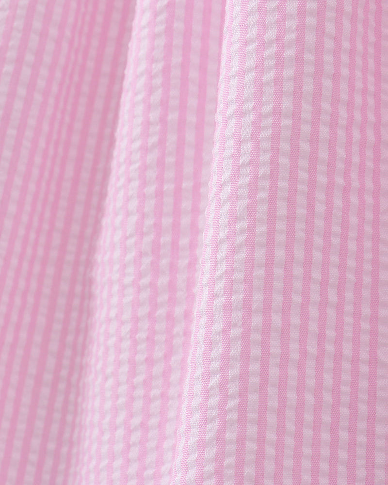 Close-up of pink fabric with a subtle pattern