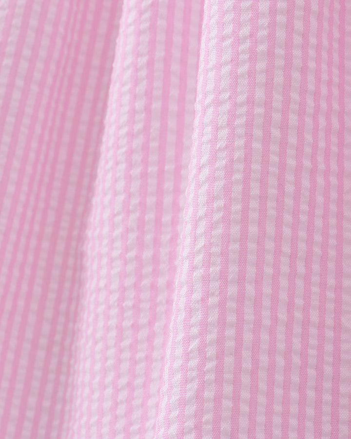 Close-up of pink fabric with a subtle pattern
