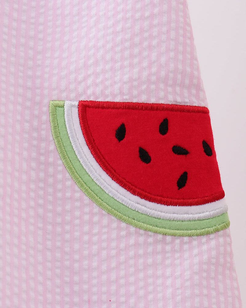 Watermelon slice design on a pink textured fabric