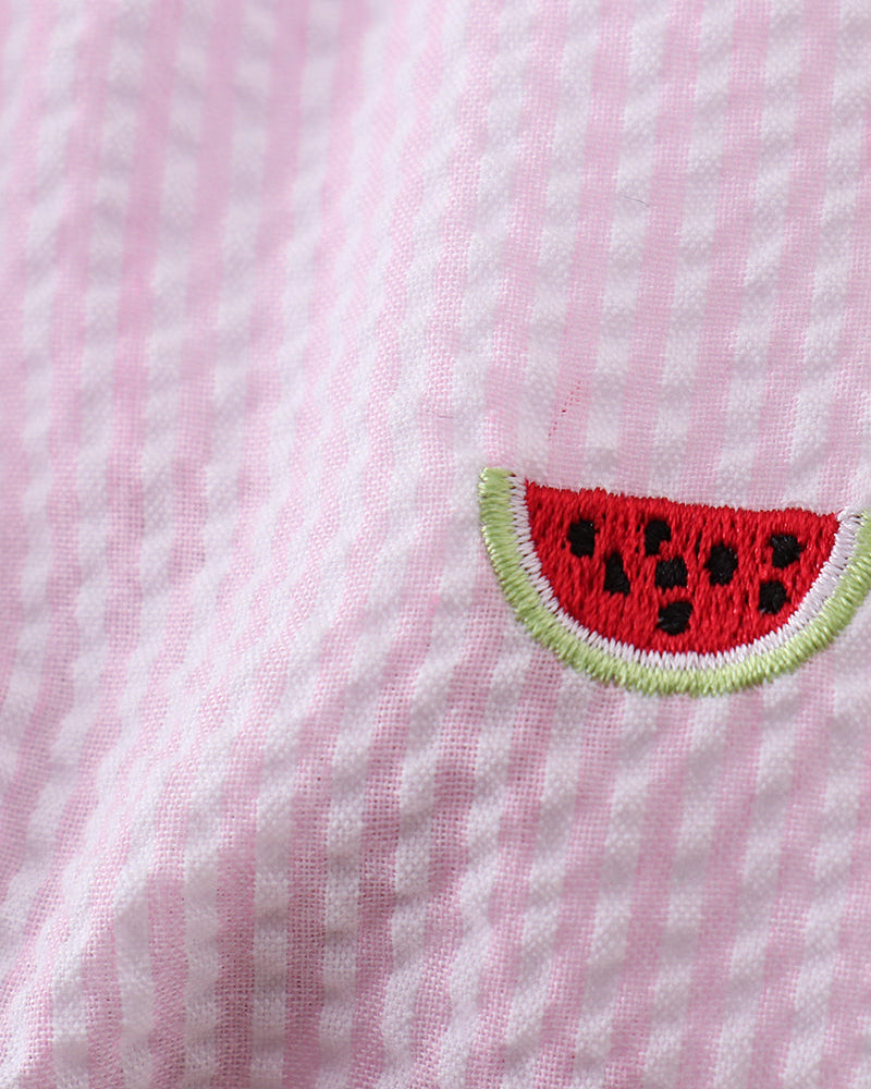 Embroidered watermelon slice on a pink and white striped fabric