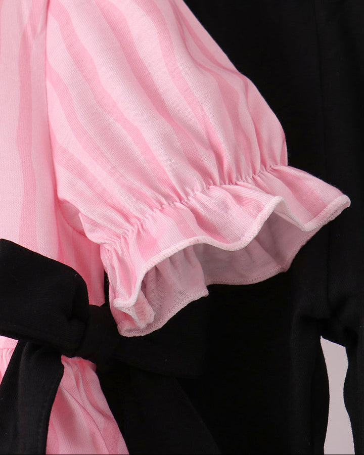 Pink striped ruffle sleeve top with black leggings waistband and bow trim