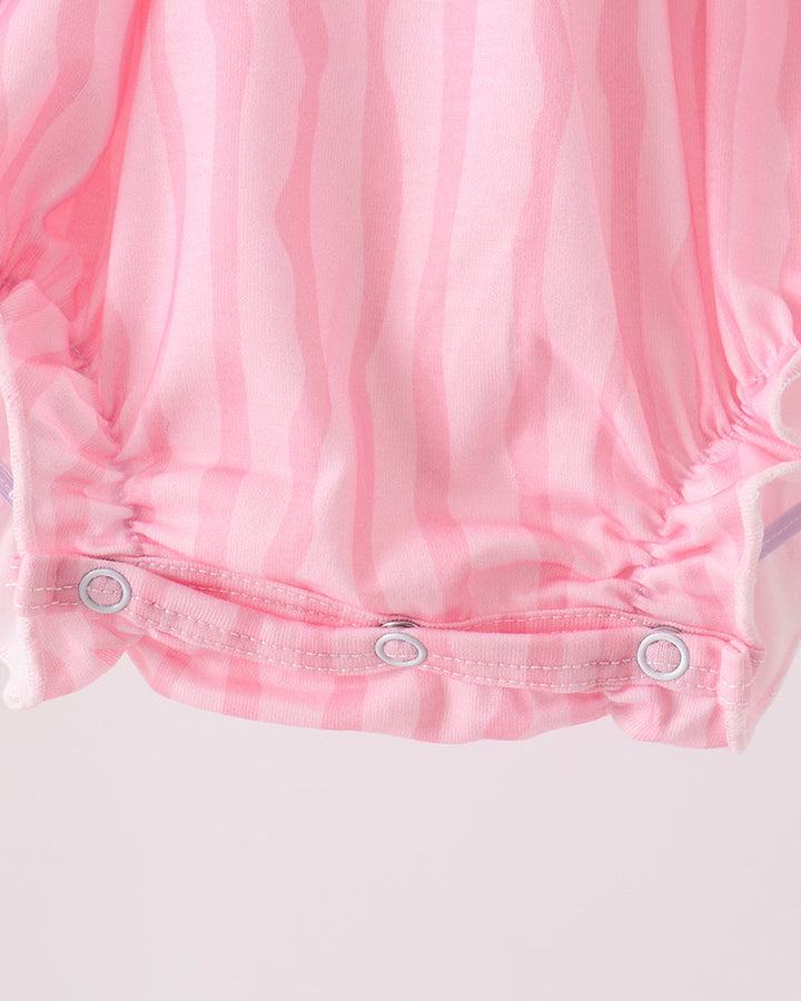 Pink romper shorts with snap-button placket at gathered ruffle hem
