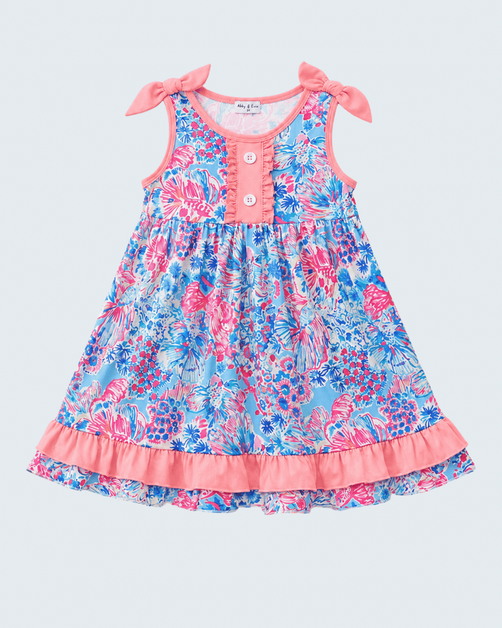 Floral dress with pink accents on a light gray background