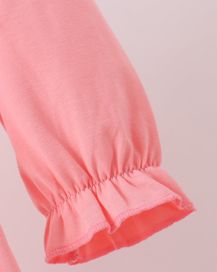 Pink long-sleeve dress with elastic cuff and ruffled sleeve hem
