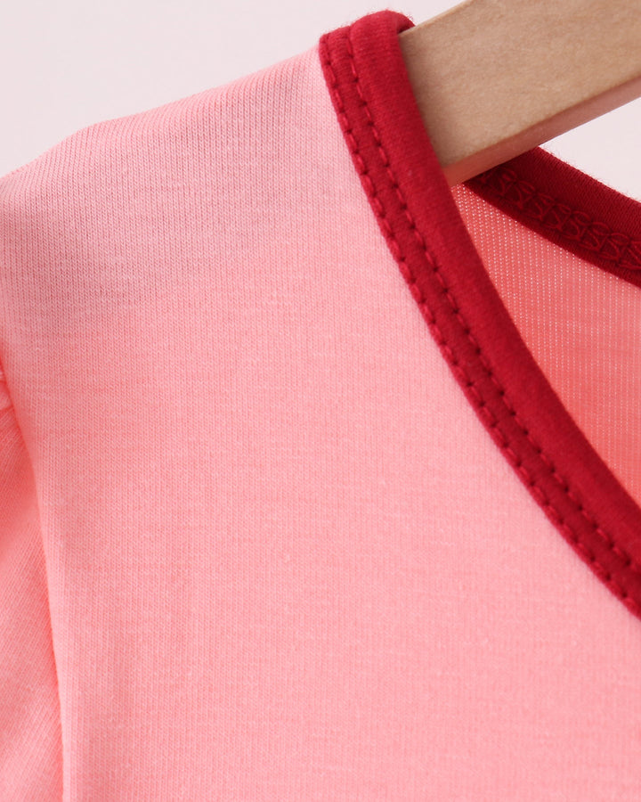 Pink dress with dark red stitched neckline trim and round collar