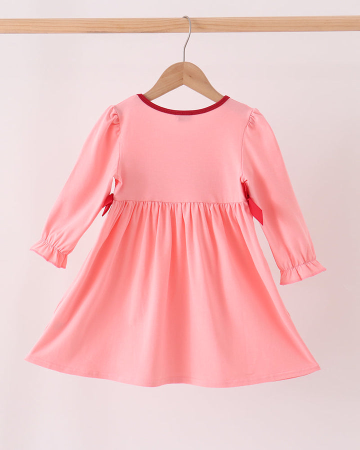 Pink long-sleeve toddler dress with gathered skirt and red-trim crew neckline