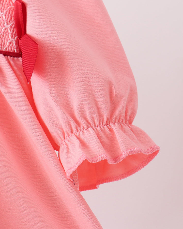 Pink gathered sleeve with small cuff ruffle detail