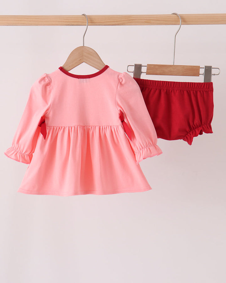 Pink long-sleeve smocked dress top with red bloomer shorts set