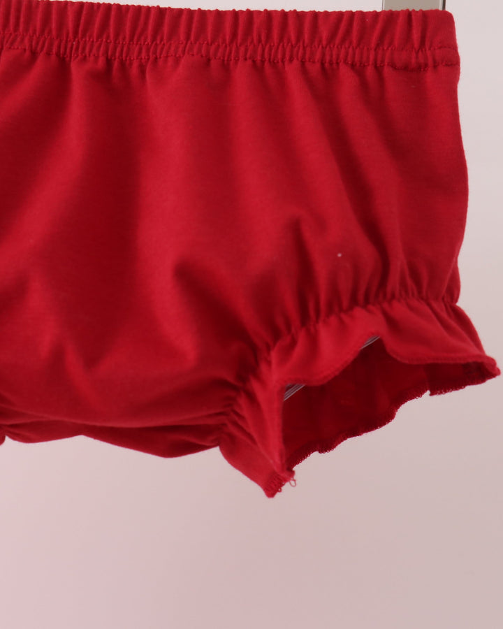 Red bloomer shorts with elastic waistband and ruffled leg hem