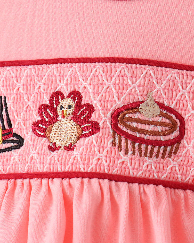 Pink smocked bodice with turkey and bow applique detail