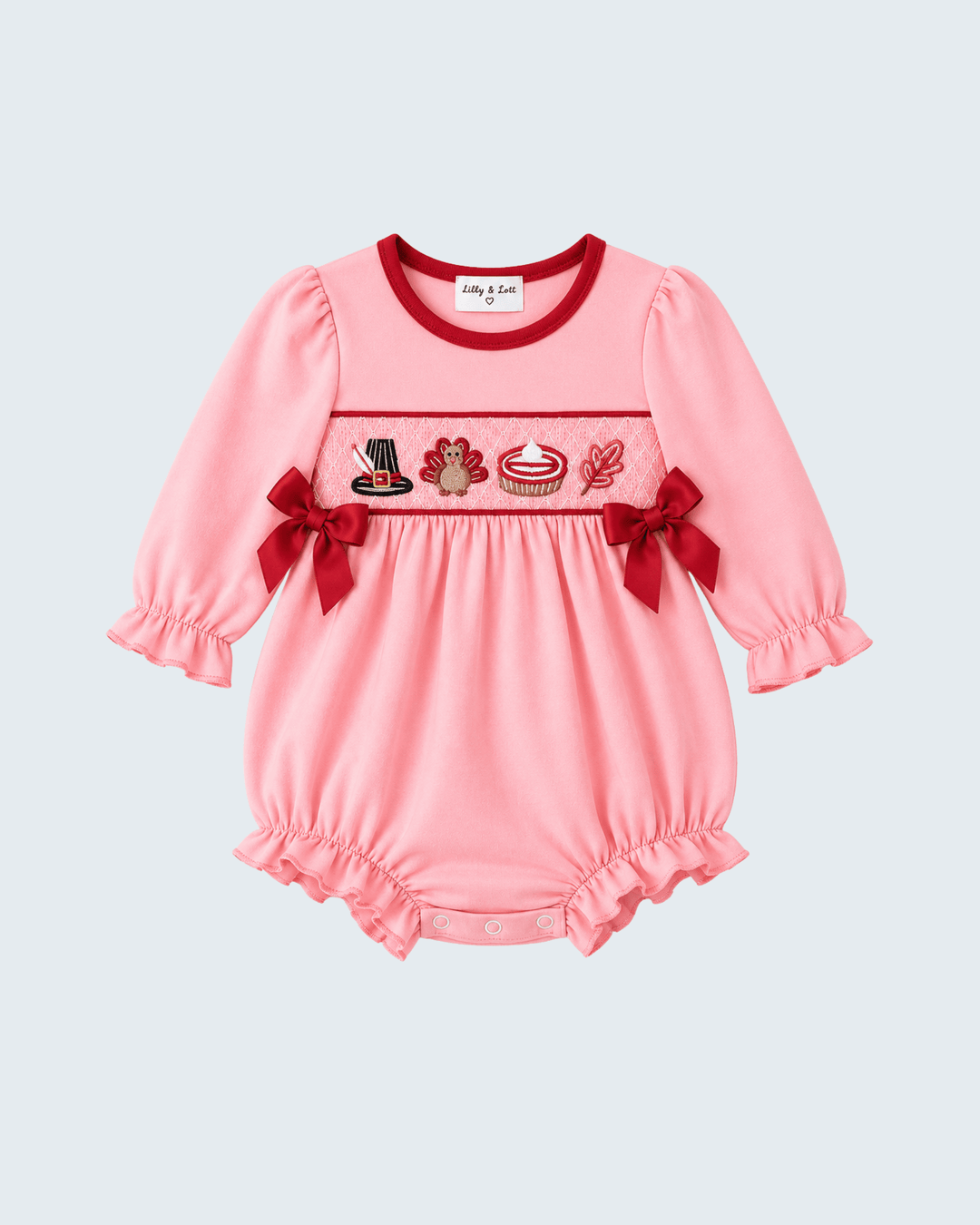 Pink smocked bow bubble romper with long sleeves and embroidered turkey chest