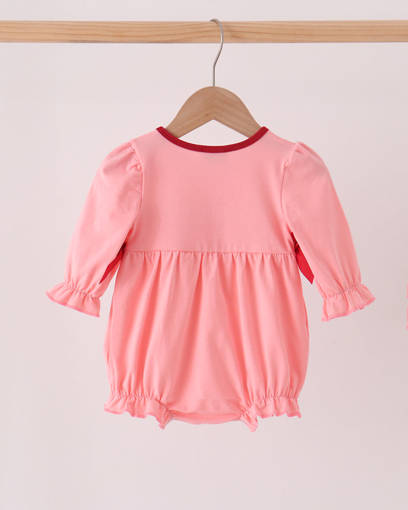 Pink baby bubble romper with long sleeves and gathered waist