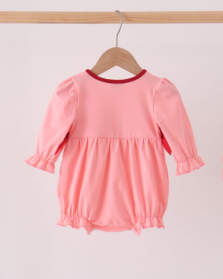 Pink baby bubble romper with long sleeves and gathered waist
