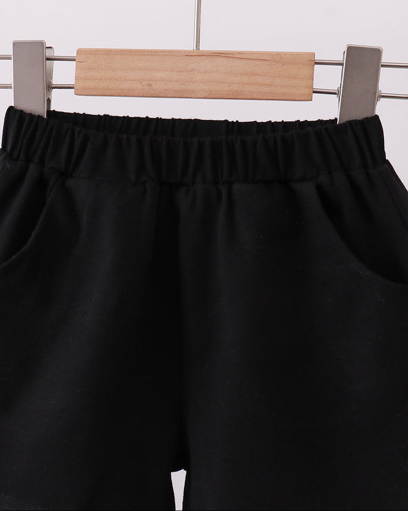 Black shorts with elastic waistband, side pleats, and relaxed fit.
