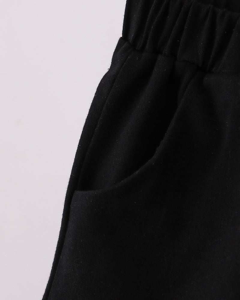 Black shorts with elastic waistband and roomy leg opening.