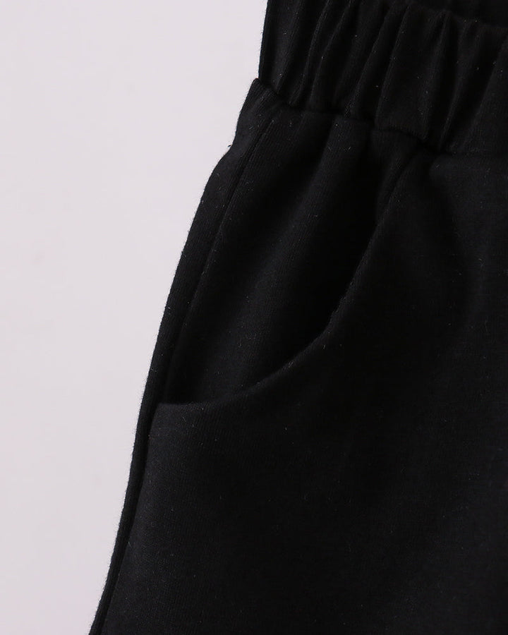 Black shorts with elastic waistband and roomy leg opening.