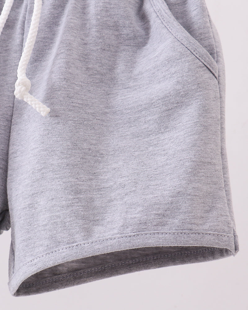Grey shorts with drawstring cord and slanted pocket seam