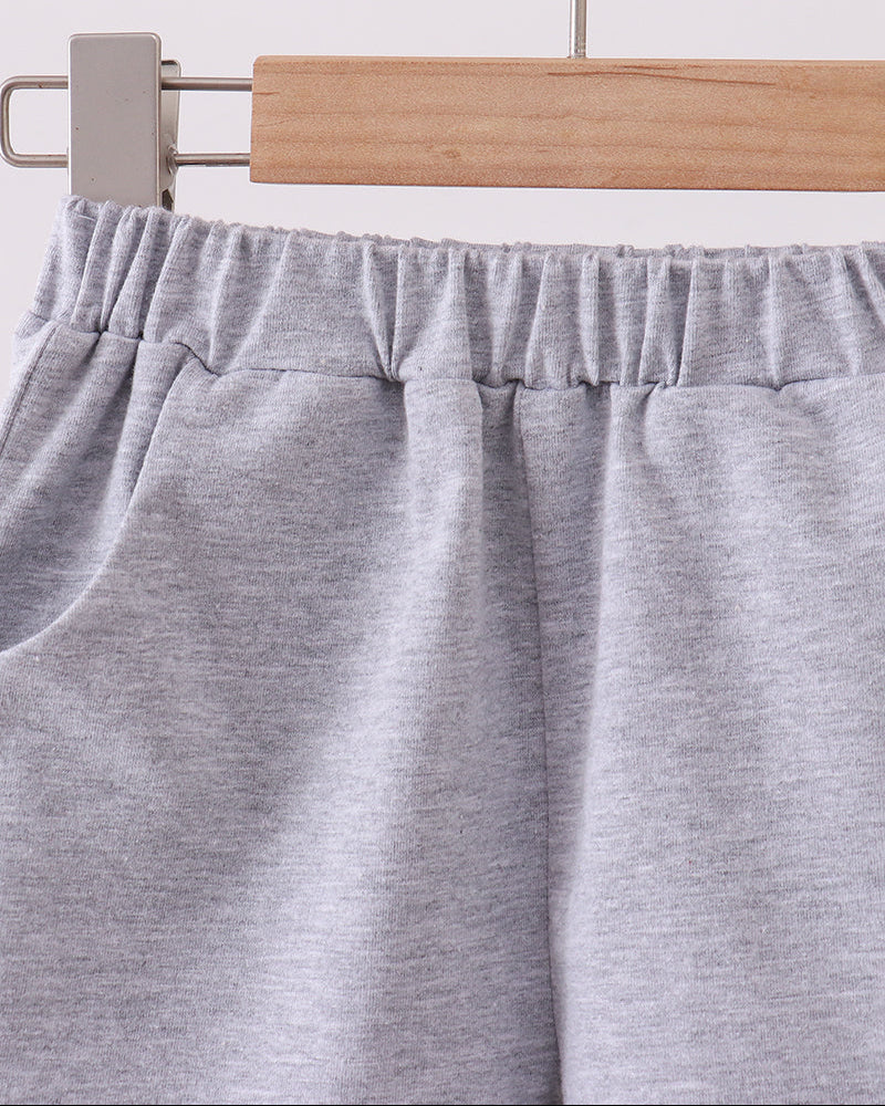 Light grey shorts with elastic waistband and gathered front crease