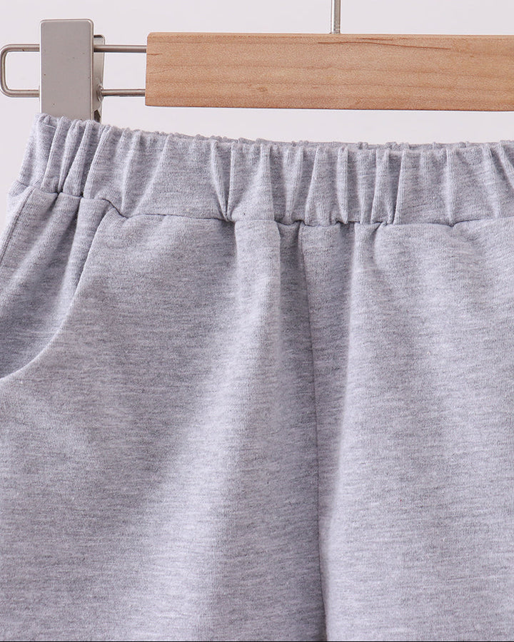 Light grey shorts with elastic waistband and gathered front crease