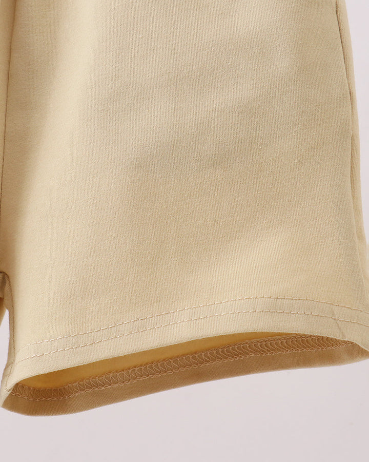 Light khaki shorts with stitched hem and clean leg finish