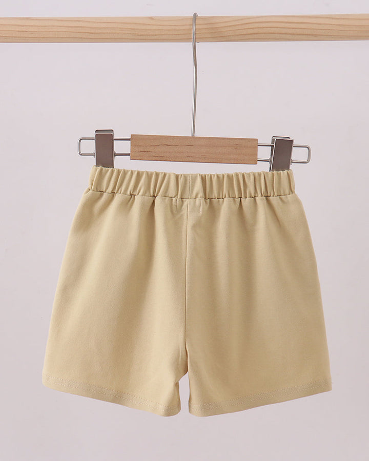 Light khaki shorts with elastic waistband and relaxed straight legs