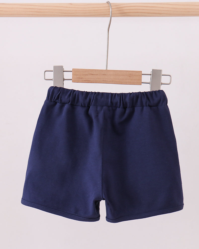 Navy drawstring shorts on hanger with elastic waistband
