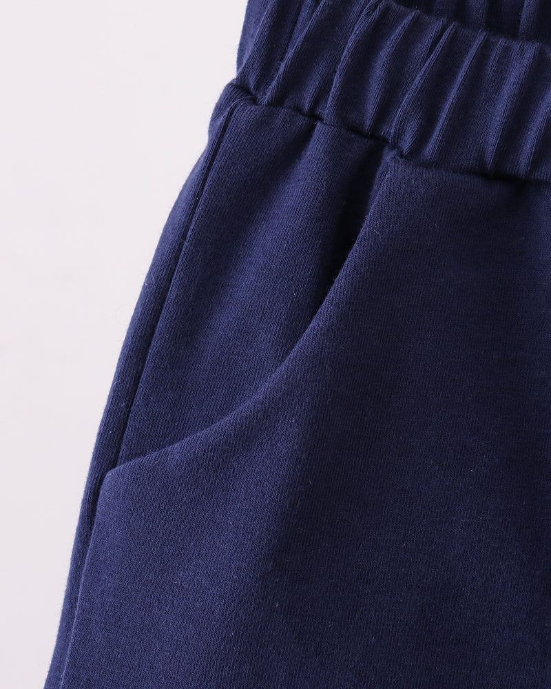 Navy shorts with wide elastic waistband, side view