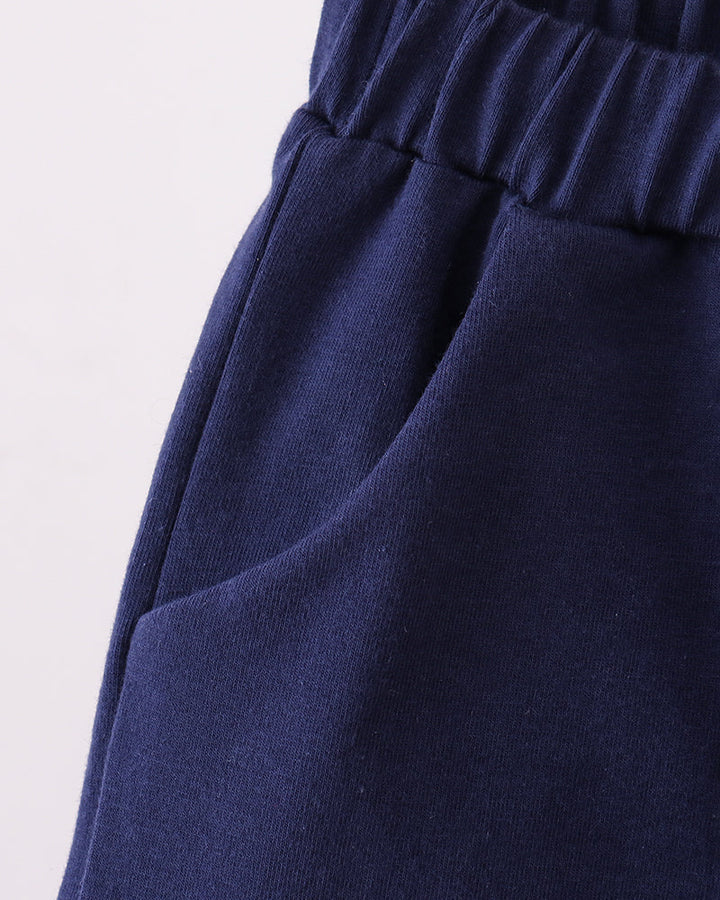 Navy shorts with wide elastic waistband, side view